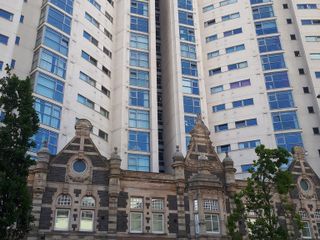 Un nuovo palazzo con integrata una costruzione storica