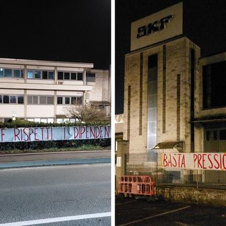 ingresso di fabbrica con striscioni appesi