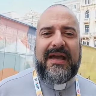 Una immagine di archivio di don Marco Ghiazza