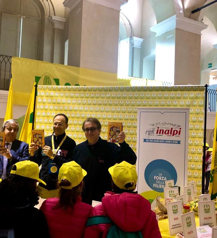 Inalpi e Coldiretti ancora insieme a Spaggiari per portare il genio di Nespolo tra i banchi