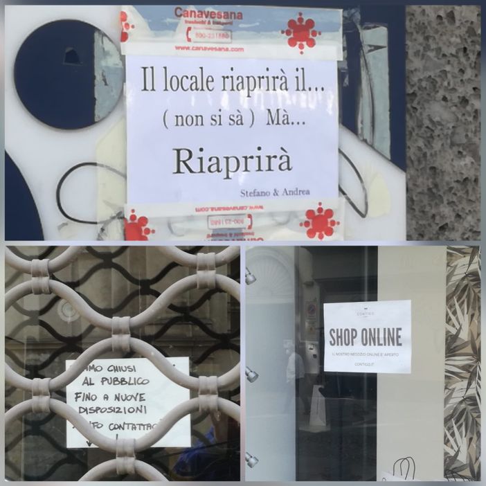 Cartelli sulle vetrine dei negozi