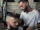 Achille Lamura nel suo Barber Garage