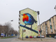 Il murales a forma di pettirosso in corso Piemonte