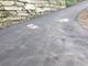 La curva asfaltata in via Costa Lorenzo