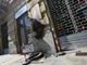 La lapida danneggiata dall'incendio