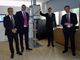 quattro persone in posa in un laboratorio