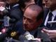 Silvio Berlusconi circondato dai microfoni