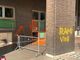scritte sui muri del comando di Polizia
