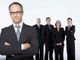 persone vestite in maniera professionale in foto di gruppo