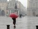 pioggia in piazza San Carlo, persona con ombrello