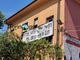 Lo striscione di contestazione al sindaco, appeso all'esterno di Radio Black out