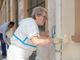 Vanchiglia, i residenti ritinteggiano muri e panchine di Via Balbo