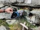 La scarpa e la croce riposizionate al Colle Manzol