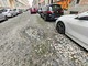 Una immagine delle buche di via Parma Una immagine delle buche di via Parma