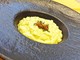 Cremoso di risotto allo zafferano filietti di acciuga e limone