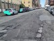 Buche e strada dissestata in via Forlì