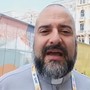 Una immagine di archivio di don Marco Ghiazza