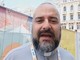 Una immagine di archivio di don Marco Ghiazza