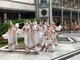 danzatrici con fiori in centro a Torino