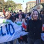 Maschere della premier e di Crosetto nello sciopero dei Fridays For Future
