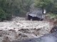 strada devastata dopo l'alluvione dello scorso ottobre