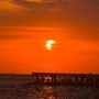 Eclissi parziale di sole, lo spettacolo al tramonto nei cieli d'Italia