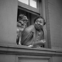 GORDON PARKS - Woman and dog in window, Harlem, New York -1943
